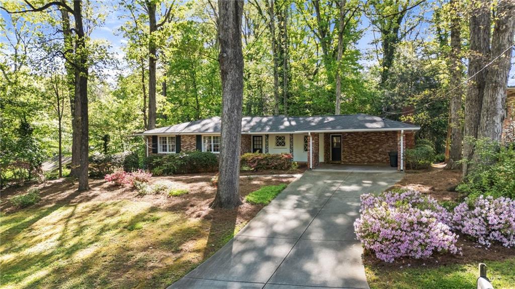 2235 Winding Way Tucker, GA 30084 - Photo 3 of 31 a front view of a house with garden