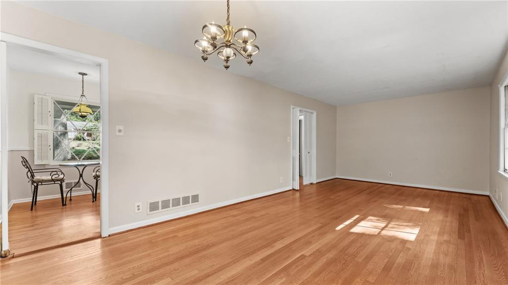 2235 Winding Way Tucker, GA 30084 - Photo 6 of 31 a view of an empty room with wooden floor and a window