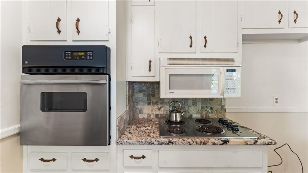 2235 Winding Way Tucker, GA 30084 - Photo 10 of 31 a stove top oven sitting inside of a kitchen