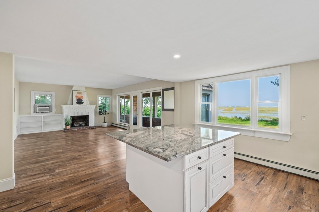 42 Damons Point Circle Marshfield, MA 02050 - Photo 6 of 21 a view of living room kitchen with furniture and flat screen tv