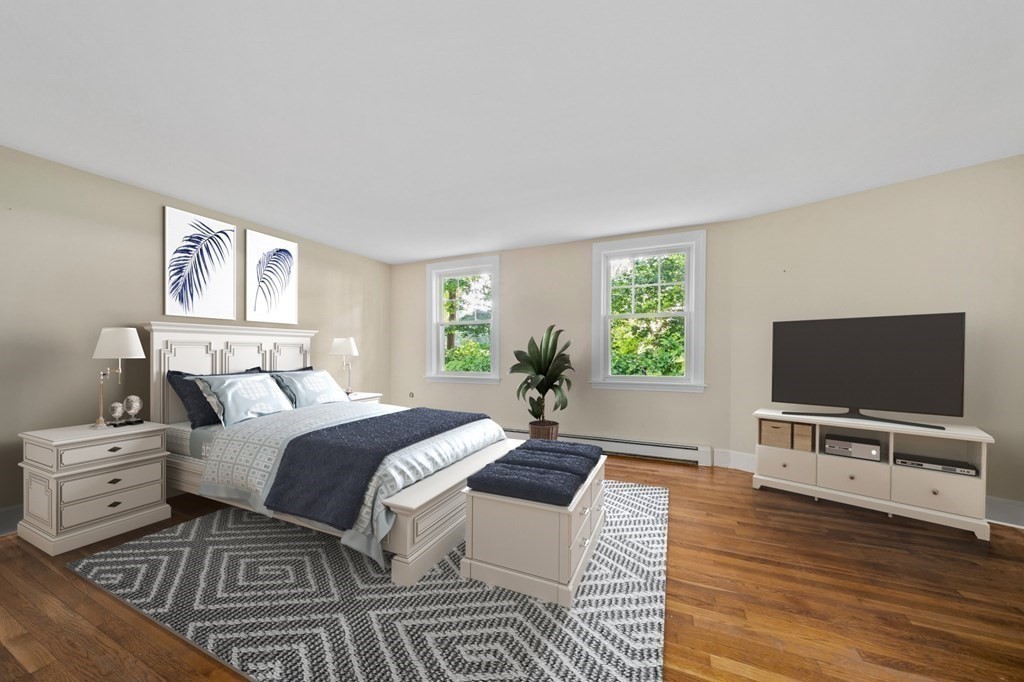 42 Damons Point Circle Marshfield, MA 02050 - Photo 9 of 21 a bedroom with furniture and a flat screen tv