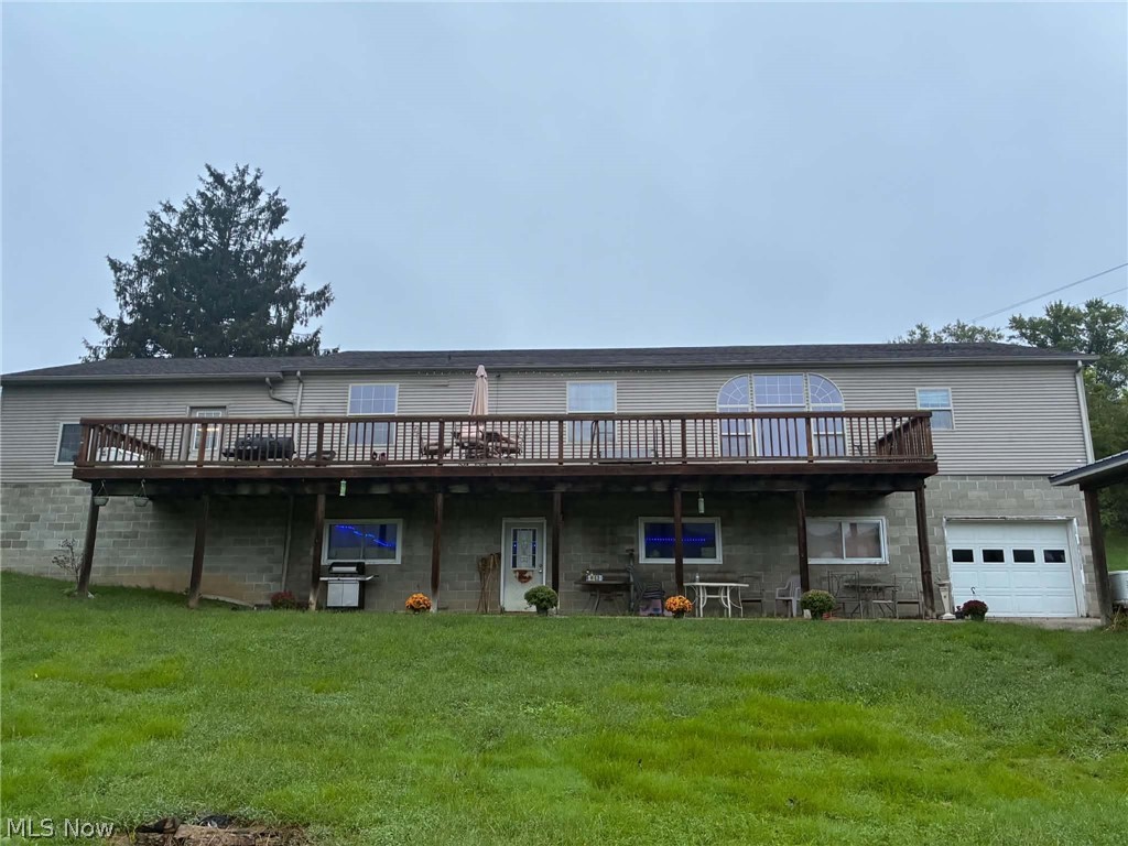 4601 Bessemer Road Nelsonville, OH 45764 - Photo 25 of 25 Multi-level siding exterior with a full-width upper deck featuring wood railing