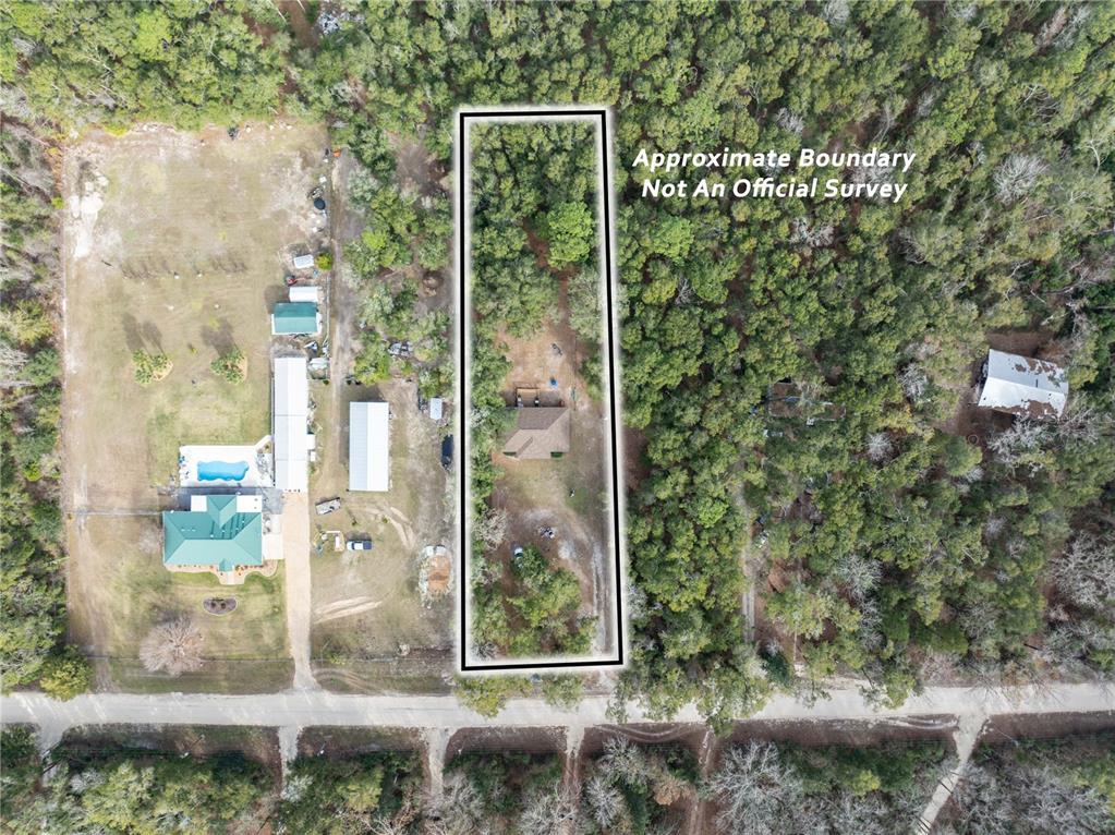 4113 288th Terrace Branford, FL 32008 - Photo 29 of 35 a front view of a house with a yard