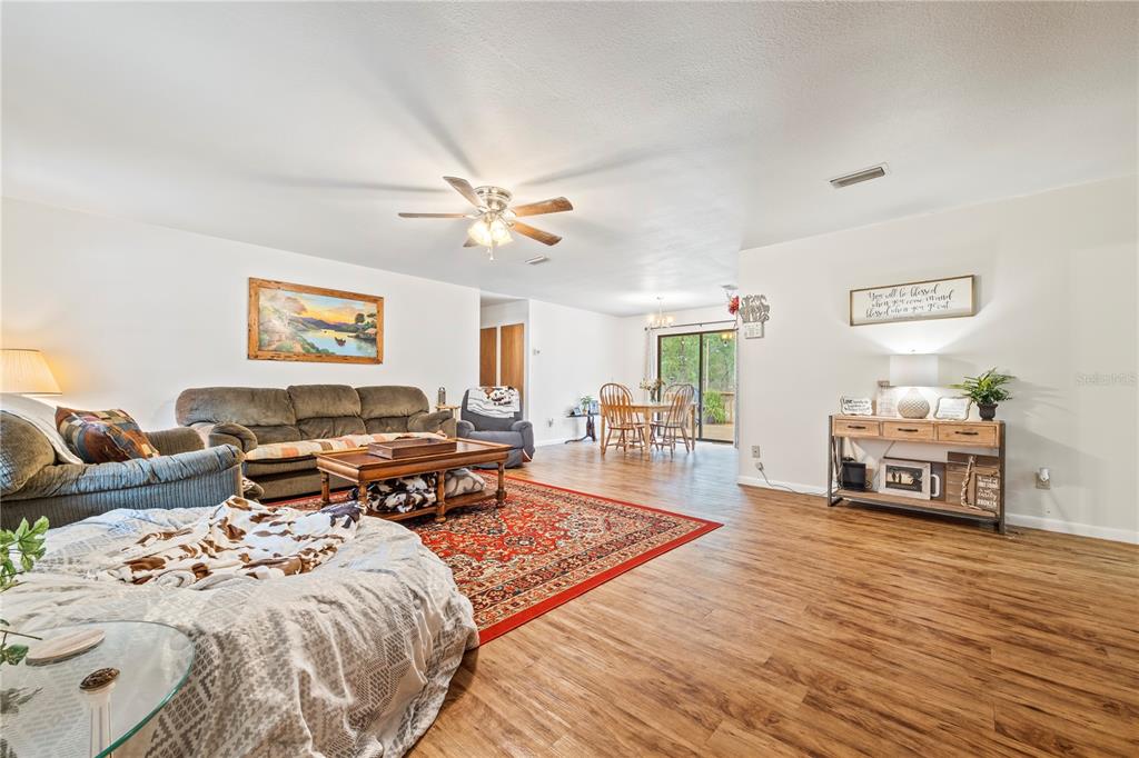 4113 288th Terrace Branford, FL 32008 - Photo 9 of 35 a living room with furniture and wooden floor