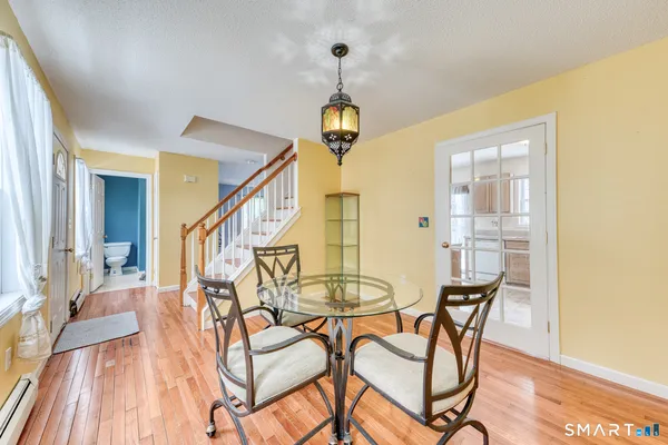 a view of a livingroom with furniture and hardwood floor