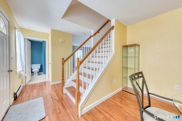 a view of an entryway with wooden floor