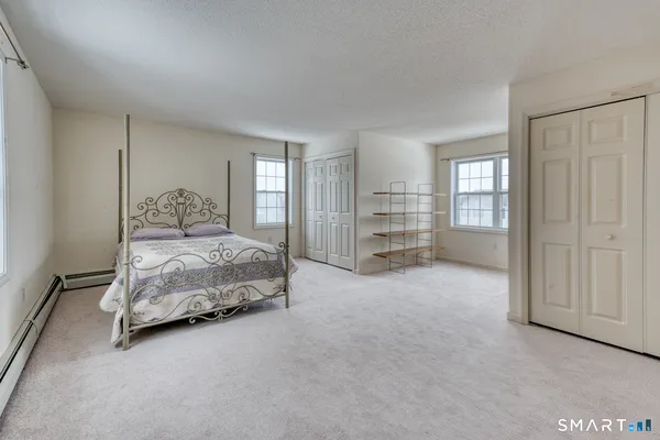 a bedroom with a bed and a cabinets