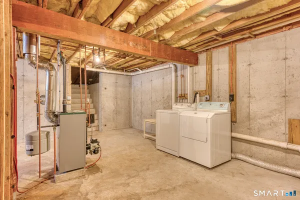a bathroom with a sink a mirror and shower