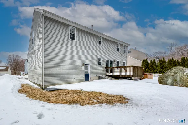 a view of a house with a snow in the yard