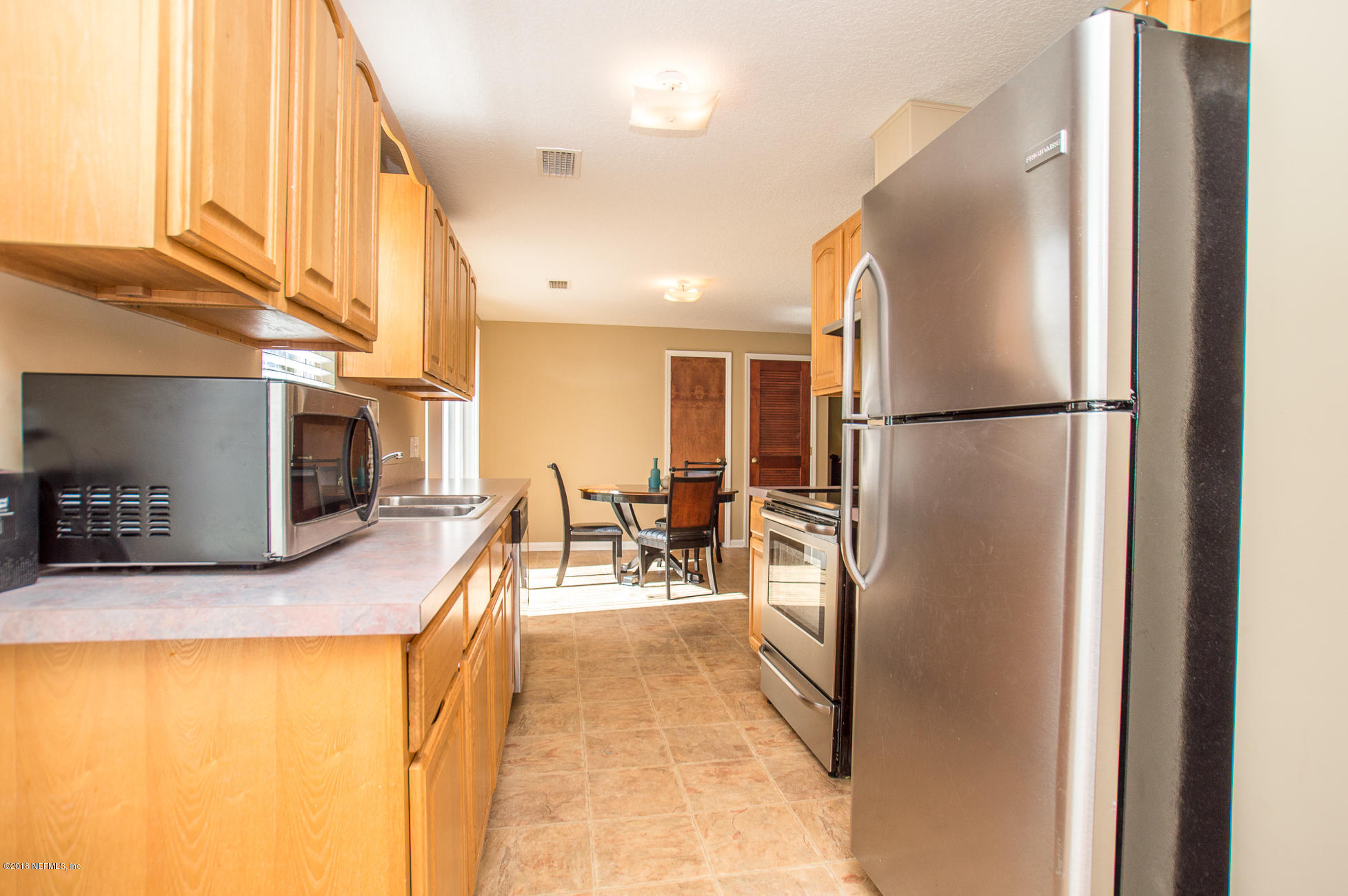 44135 Quail Ridge Avenue East Callahan, FL 32011 - Photo 5 of 15 Galley Kitchen View to Dining Area