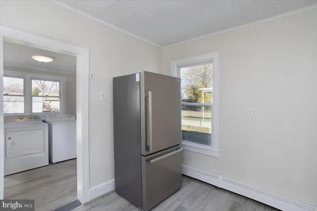 a white refrigerator freezer sitting inside of a kitchen