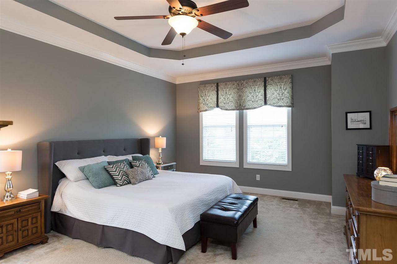 10121 Darling Street Raleigh, NC 27613 - Photo 11 of 25 a bedroom with a bed and a window