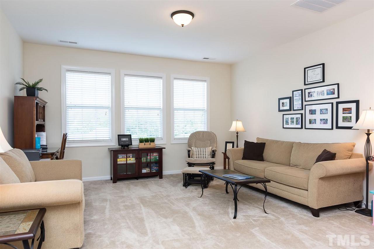 10121 Darling Street Raleigh, NC 27613 - Photo 14 of 25 a living room with furniture and a large window