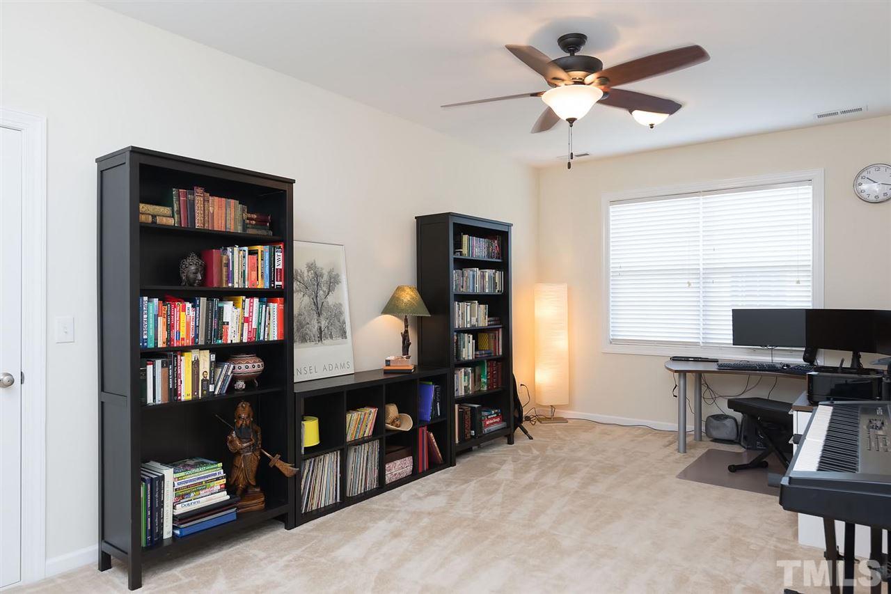 10121 Darling Street Raleigh, NC 27613 - Photo 16 of 25 a view of a workspace with furniture and a window
