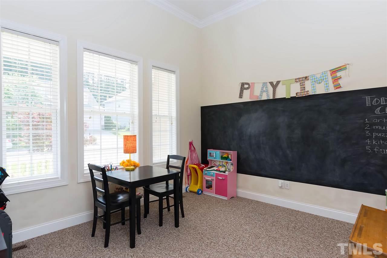 10121 Darling Street Raleigh, NC 27613 - Photo 3 of 25 a reading room with furniture and a window