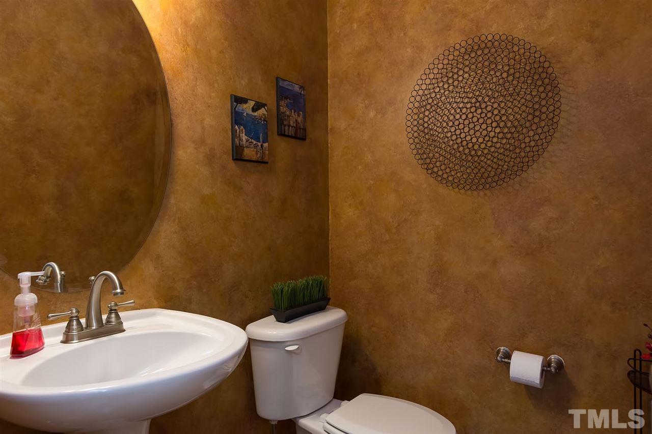 10121 Darling Street Raleigh, NC 27613 - Photo 10 of 25 a bathroom with a sink mirror and toilet