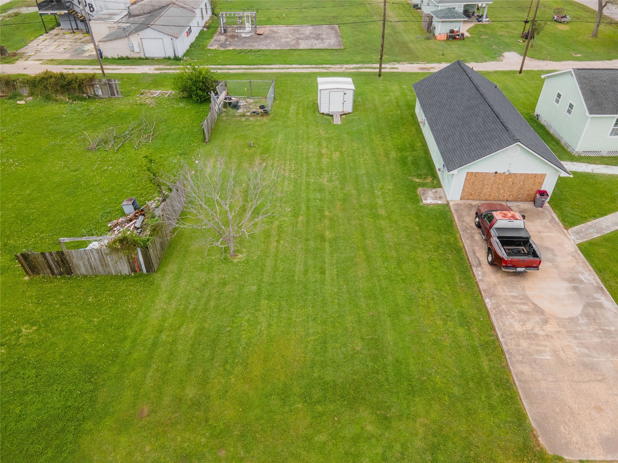 414 South Avenue B Freeport, TX 77541 - Photo 2 of 14 a backyard of a house with table and chairs