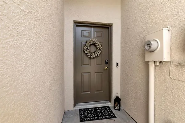 a view of an entryway with wooden floor