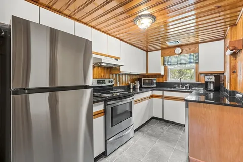 a kitchen with stainless steel appliances a refrigerator and a sink