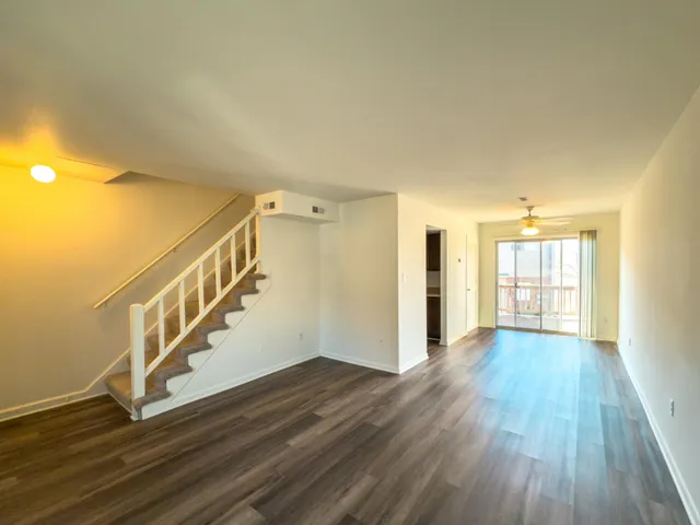 a view of an entryway with wooden floor