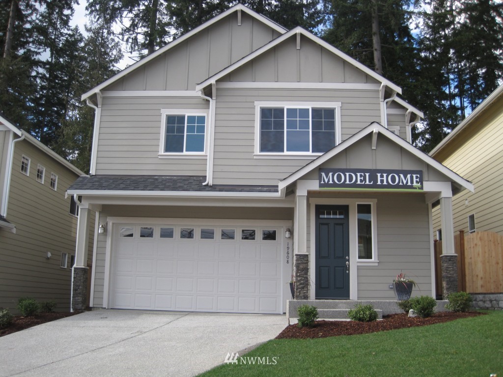 19608 4th Drive Southeast Bothell, WA 98012 - Photo 1 of 1 a front view of a house with a yard and garage