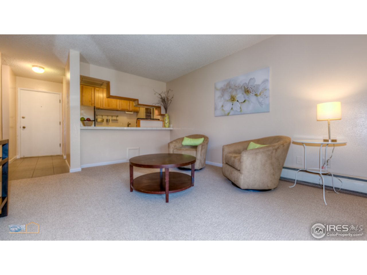 2707 Valmont Road, Unit 306A Boulder, CO 80304 - Photo 1 of 25 a living room with furniture and a lamp