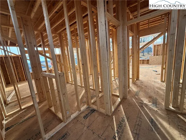 a view of a building with wooden fence