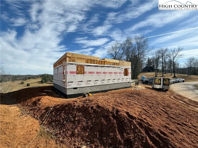 a view of road with large trees