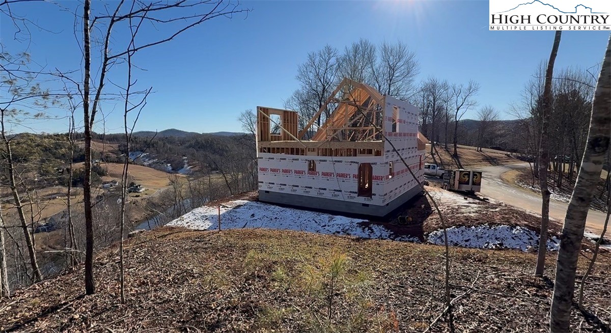 310 Autumn Run Road West Jefferson, NC 28694 - Photo 4 of 37 a view of a house with a yard