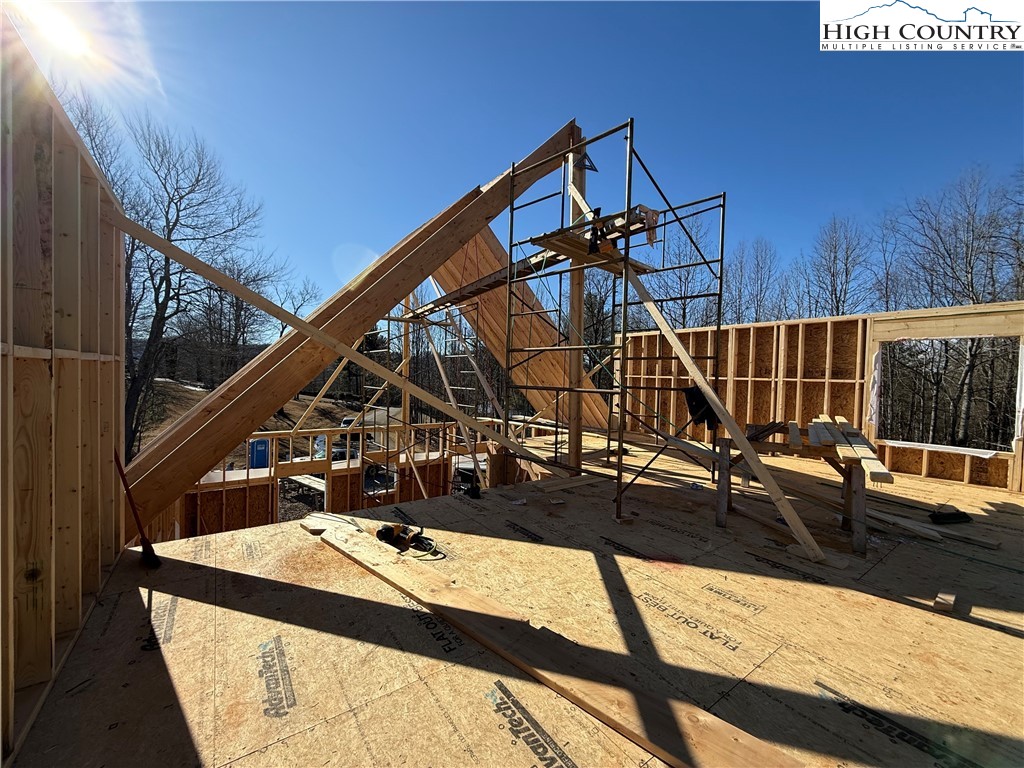 310 Autumn Run Road West Jefferson, NC 28694 - Photo 8 of 37 a view of a balcony with couch and wooden floor