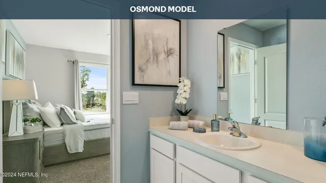 a en suite bathroom with a sink and a mirror