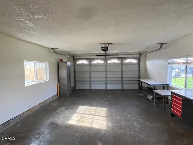 a view of a livingroom with an empty space and a window