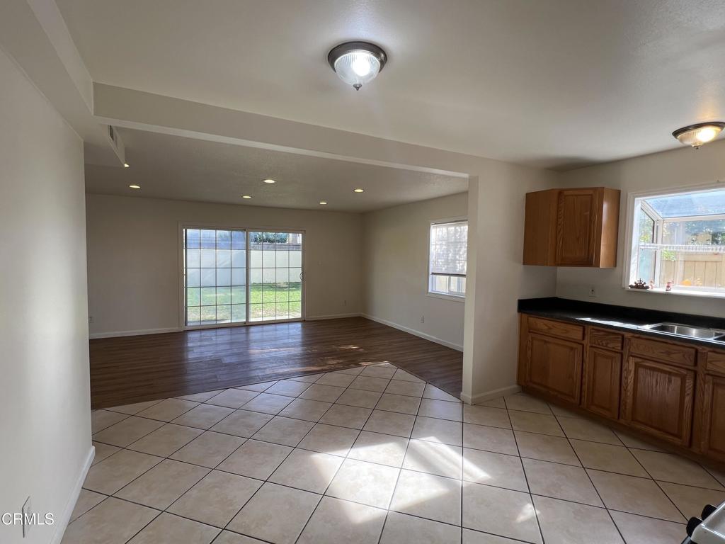 2230 Lassen Street Oxnard, CA 93033 - Photo 6 of 15 a kitchen with stainless steel appliances granite countertop a stove a sink and a refrigerator