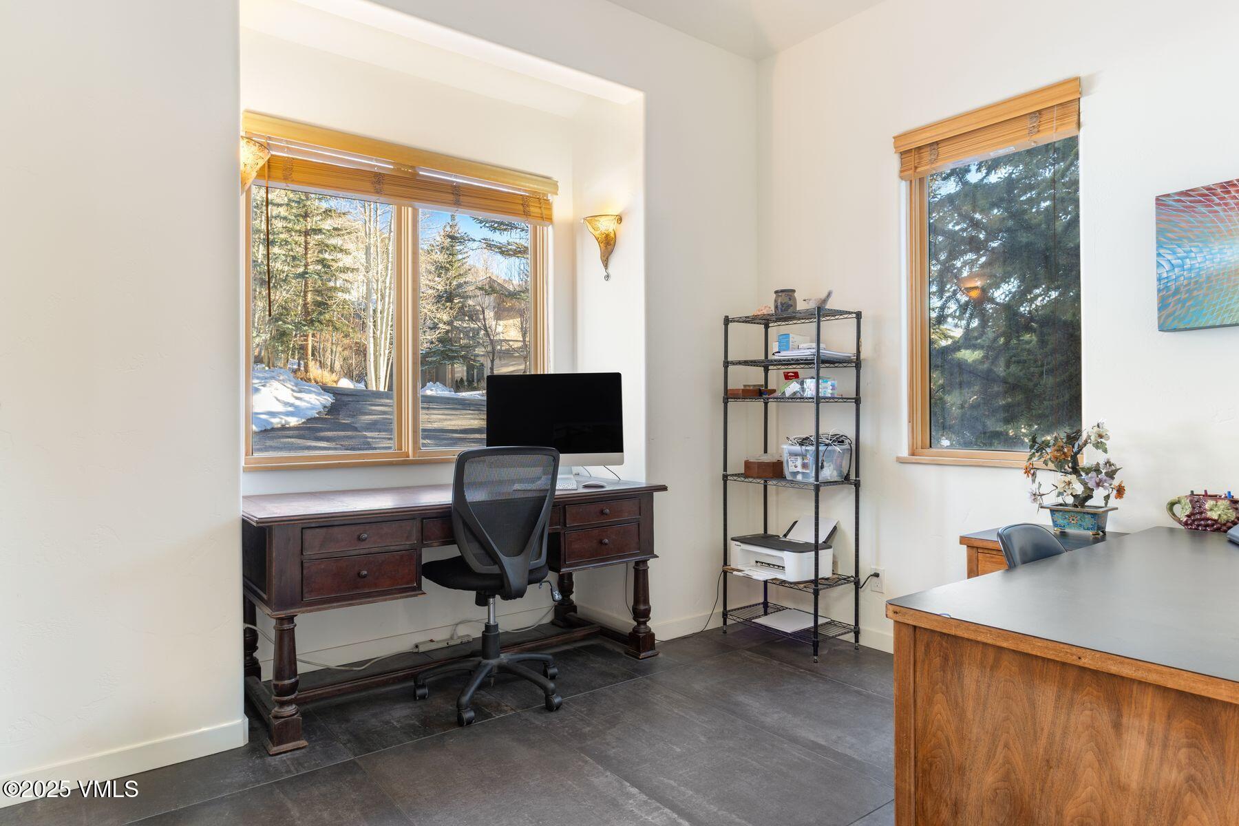 960 June Creek Road Edwards, CO 81632 - Photo 17 of 43 a view of a workspace with furniture and a window
