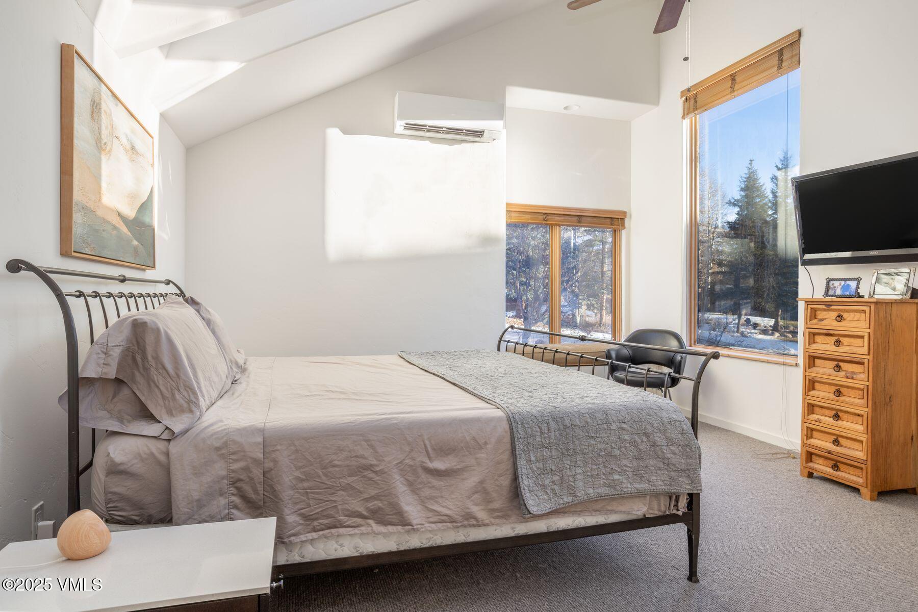 960 June Creek Road Edwards, CO 81632 - Photo 19 of 43 a bedroom with a bed and a television