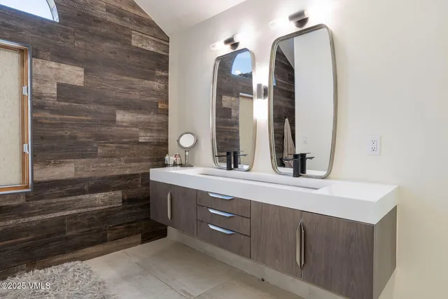 a bedroom with a bed and a fireplace