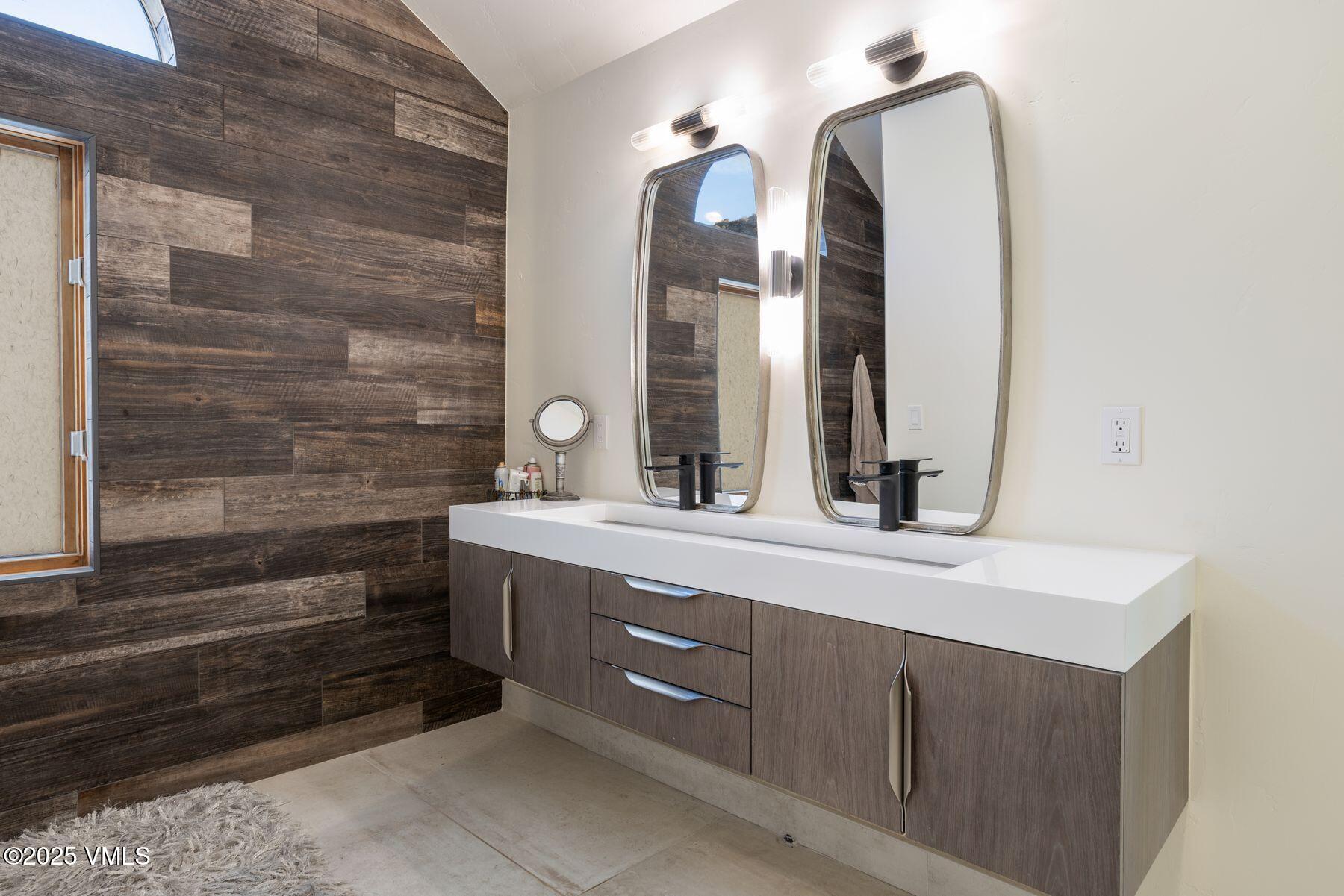 960 June Creek Road Edwards, CO 81632 - Photo 21 of 43 a bathroom with a double vanity sink and a mirror