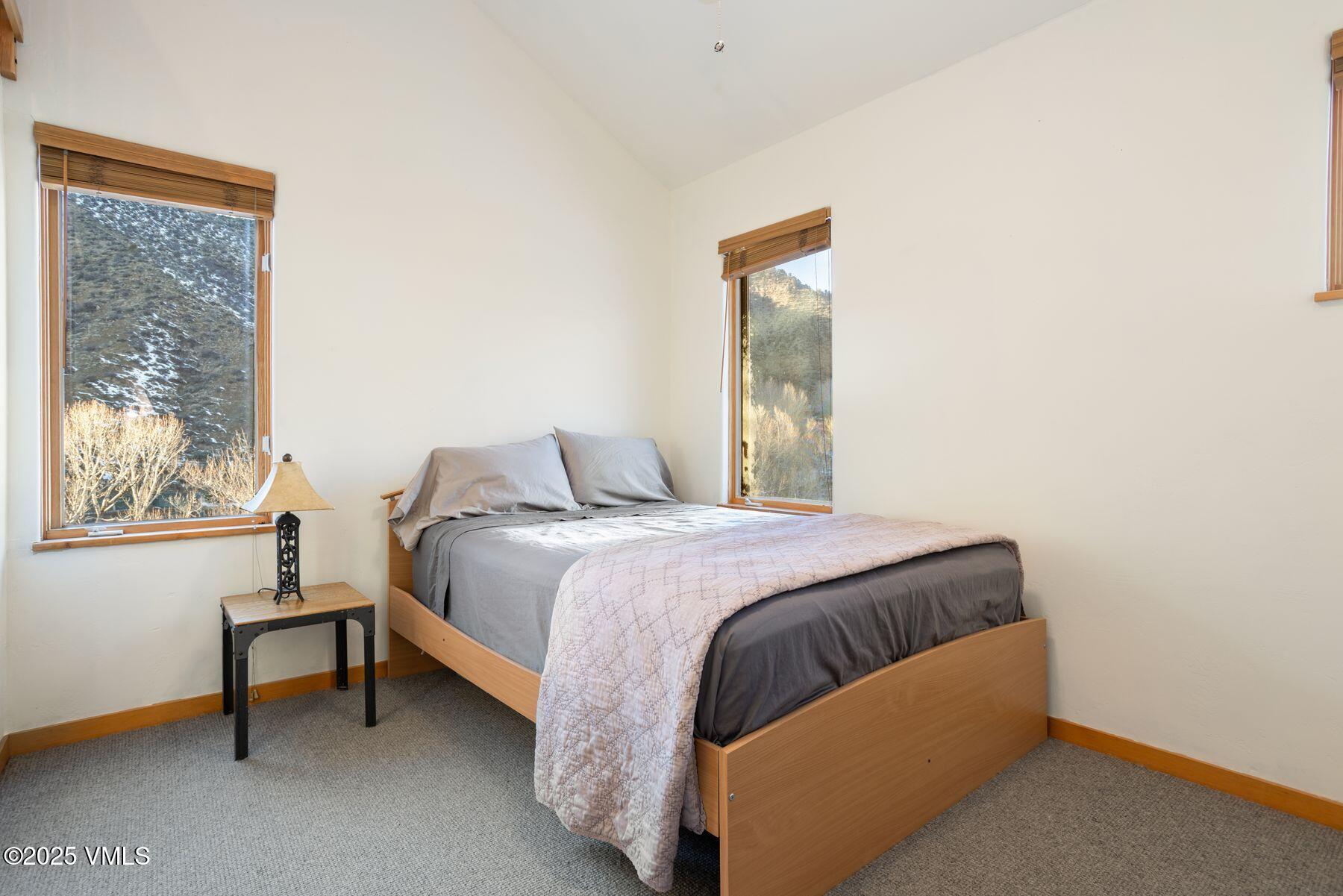 960 June Creek Road Edwards, CO 81632 - Photo 23 of 43 a bedroom with a bed and a window
