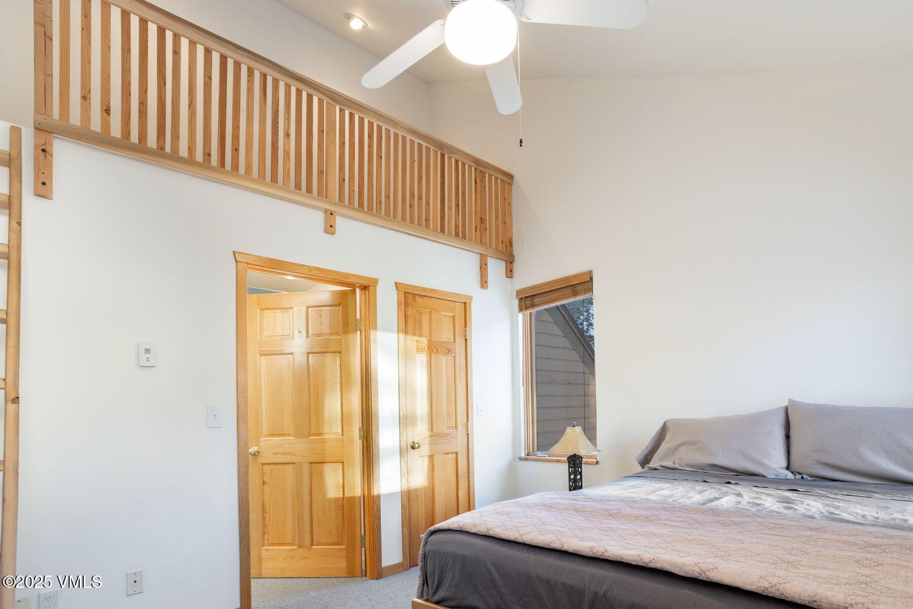 960 June Creek Road Edwards, CO 81632 - Photo 24 of 43 a bedroom with a bed and a window