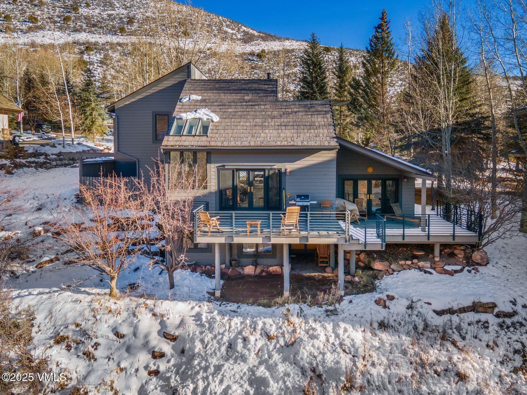 960 June Creek Road Edwards, CO 81632 - Photo 39 of 43 a view of a house with a patio table and chairs