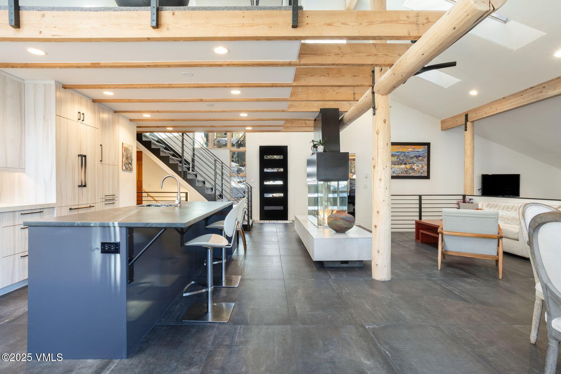 960 June Creek Road Edwards, CO 81632 - Photo 5 of 43 a living room with furniture and a wooden floor
