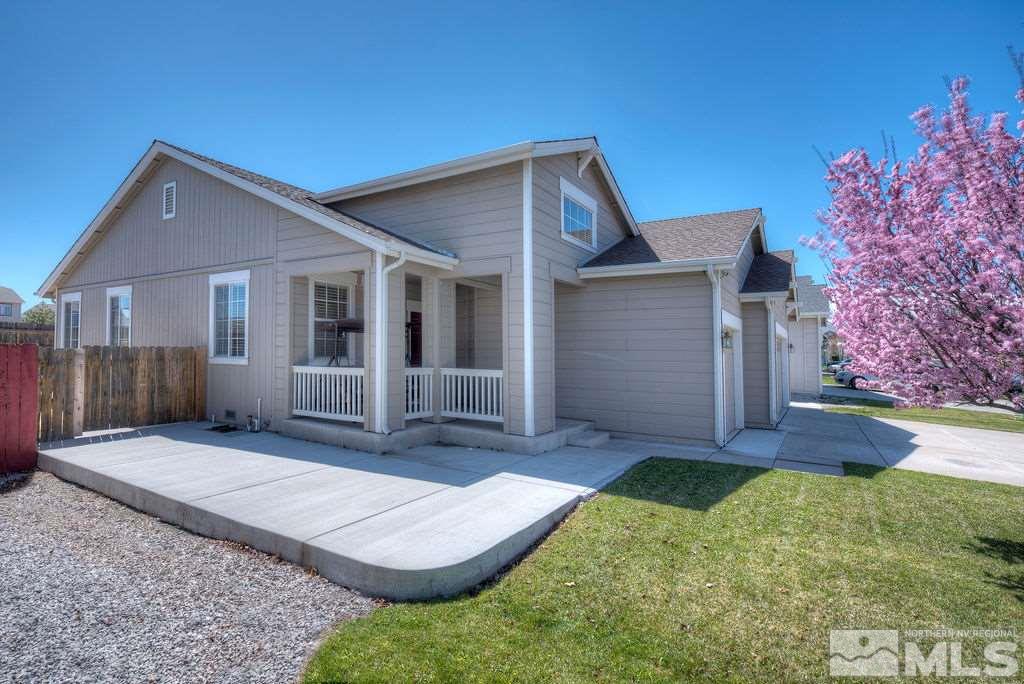 8964 Mahon Drive Reno, NV 89506 - Photo 3 of 25 front view of a house with a yard