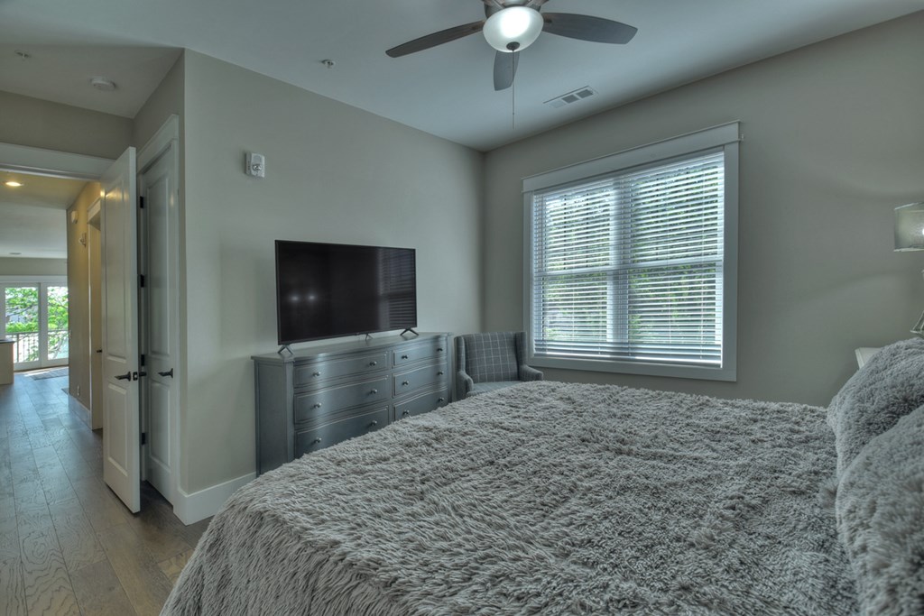 4 A Blue Ridge Street Blue Ridge, GA 30513 - Photo 27 of 31 a bedroom with a bed and a flat screen tv