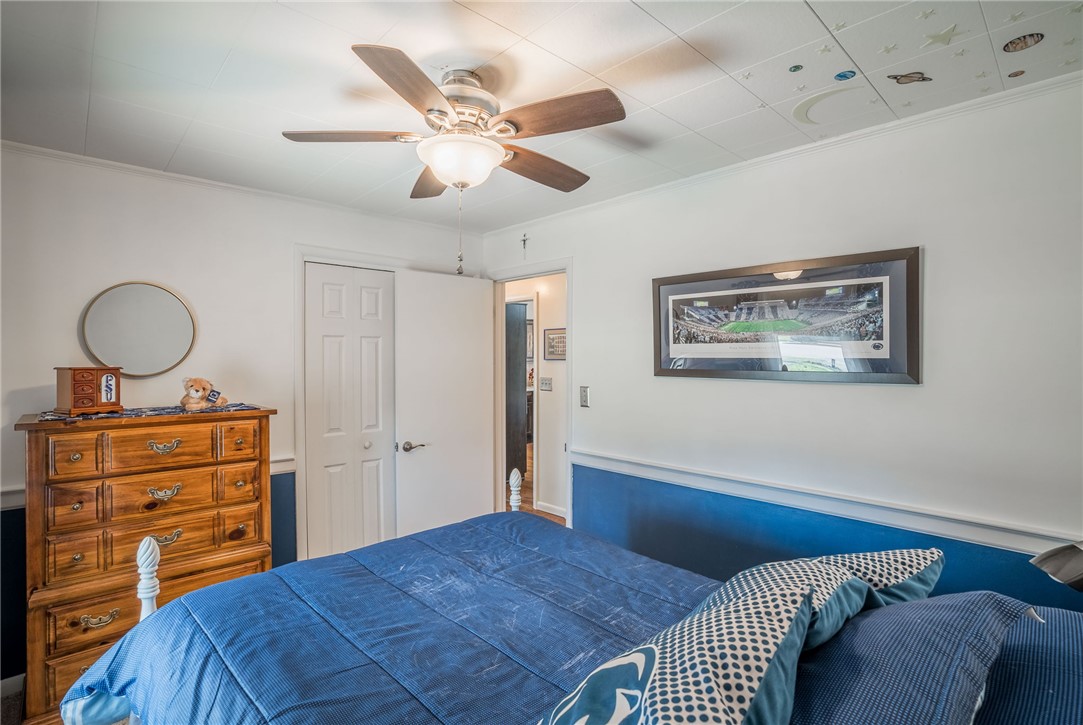 1463 Chelsea Road Troy, OH 45373 - Photo 20 of 39 This cozy bedroom features a ceiling fan, offering comfort and style.