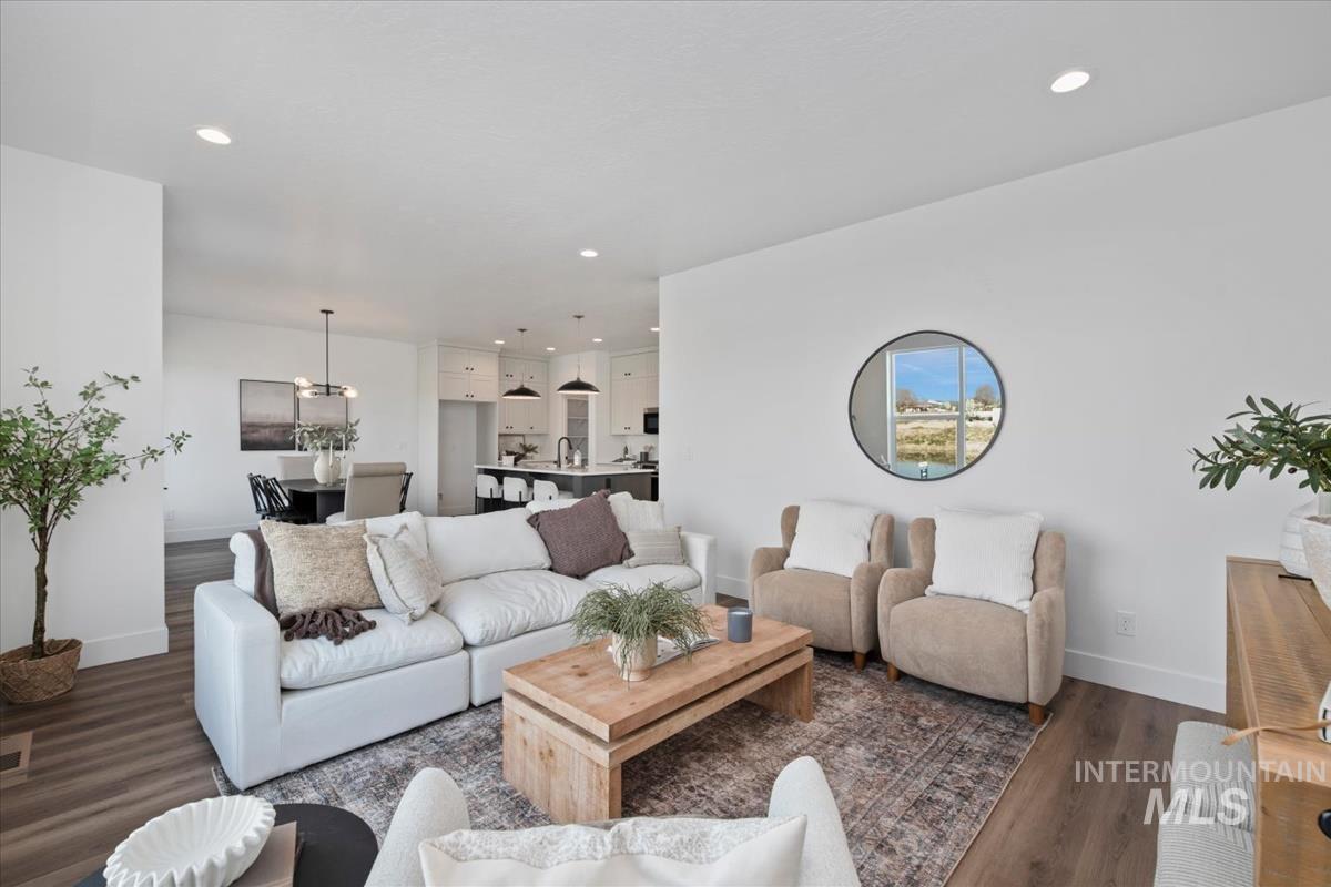 749 South Calhoun Lane Star, ID 83669 - Photo 6 of 34 Living area featuring dark wood-style floors and recessed lighting