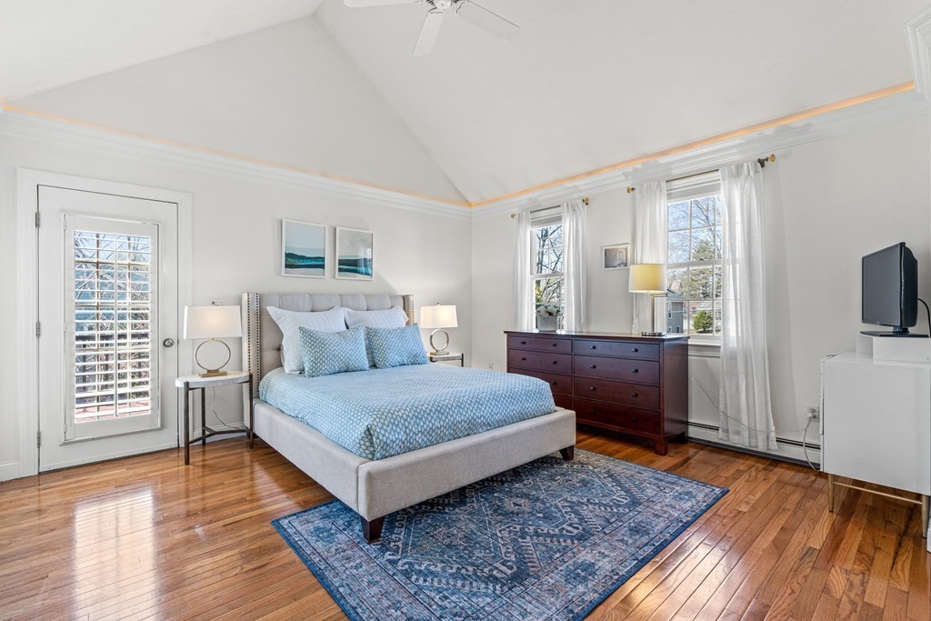 20 Walnut Street Needham, MA 02492 - Photo 12 of 27 a bedroom with a bed and wooden floor