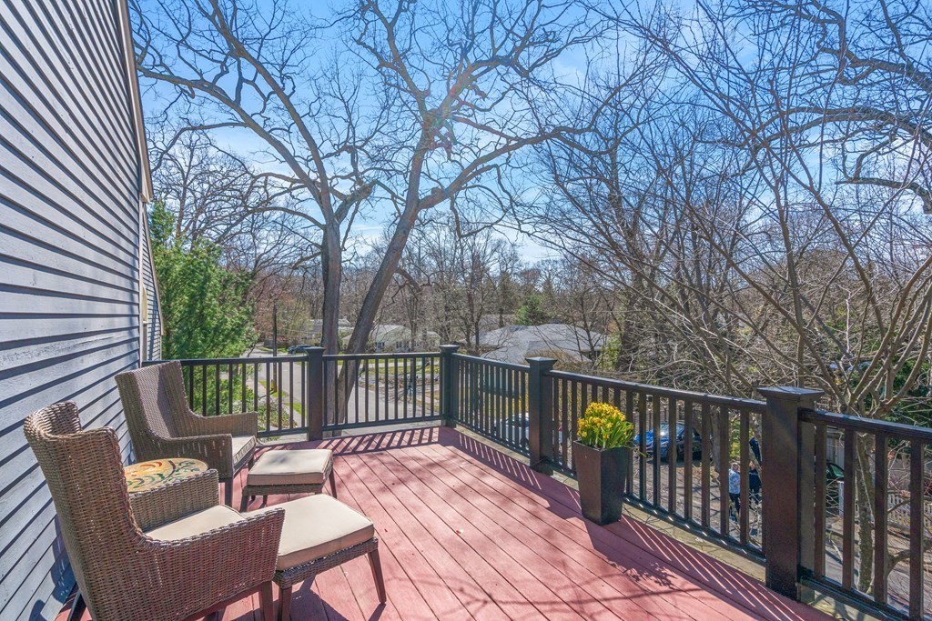 20 Walnut Street Needham, MA 02492 - Photo 15 of 27 a view of a chair and table on the deck