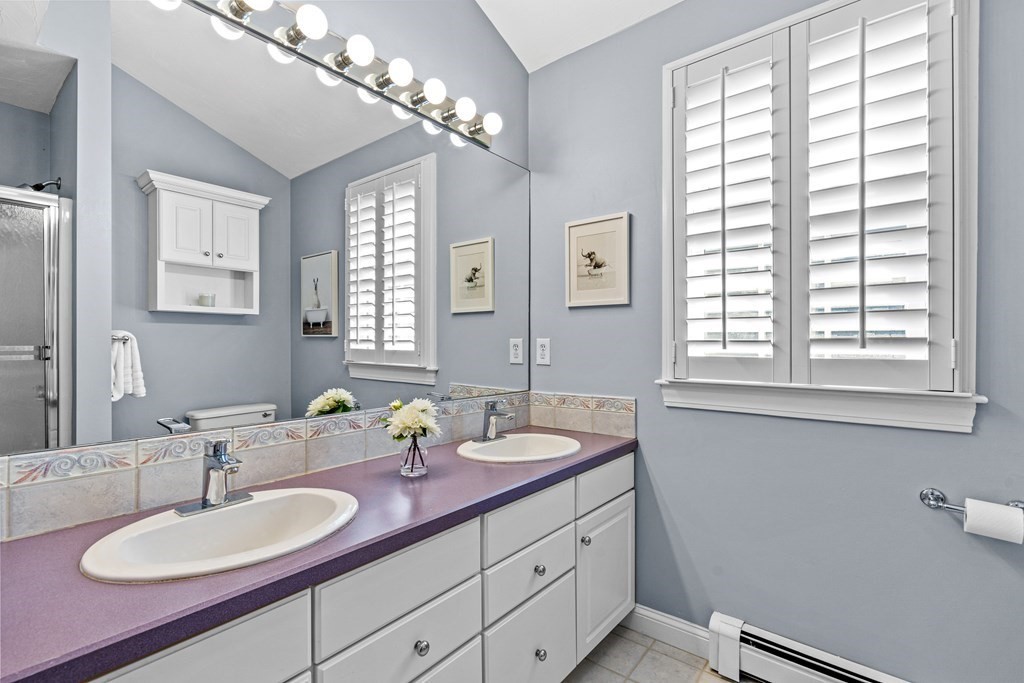 20 Walnut Street Needham, MA 02492 - Photo 19 of 27 a bathroom with a sink and a mirror