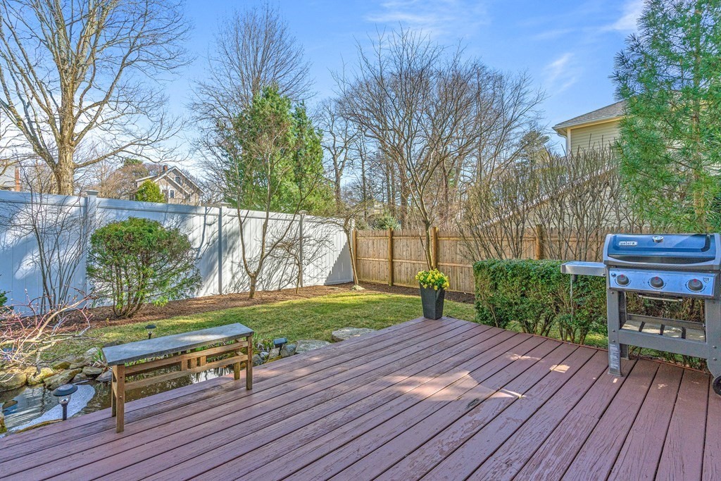 20 Walnut Street Needham, MA 02492 - Photo 23 of 27 a backyard of a house with wooden floor yard and outdoor seating