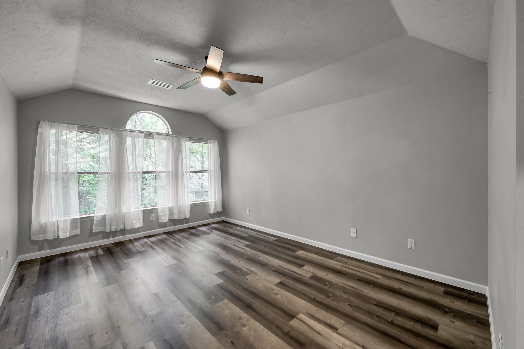 23 Alderon Woods Place Spring, TX 77382 - Photo 17 of 25 wooden floor in an empty room with a window